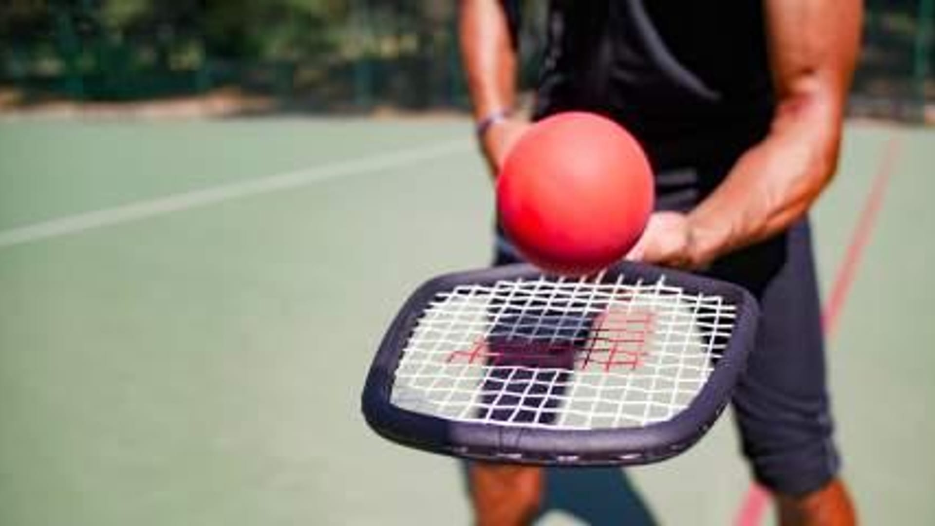 Player holding RAQQET